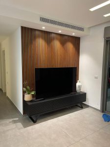 חיפוי קיר טלויזיה - יפוי קיר טלוויזיה חיפוי עץ לטלוויזיה קיר טלוויזיה מעוצב עיצוב קיר טלוויזיה חיפוי קיר בסלון חיפוי טלוויזיה מעץ עיצוב סלון עם קיר טלוויזיה קיר טלוויזיה עם נישה קיר טלוויזיה בהתאמה אישית קיר טלוויזיה עם תאורה נסתרת