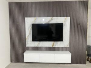 מזנונים מעוצבים לסלון - יפוי קיר טלוויזיה חיפוי עץ לטלוויזיה קיר טלוויזיה מעוצב עיצוב קיר טלוויזיה חיפוי קיר בסלון חיפוי טלוויזיה מעץ עיצוב סלון עם קיר טלוויזיה קיר טלוויזיה עם נישה קיר טלוויזיה בהתאמה אישית קיר טלוויזיה עם תאורה נסתרת